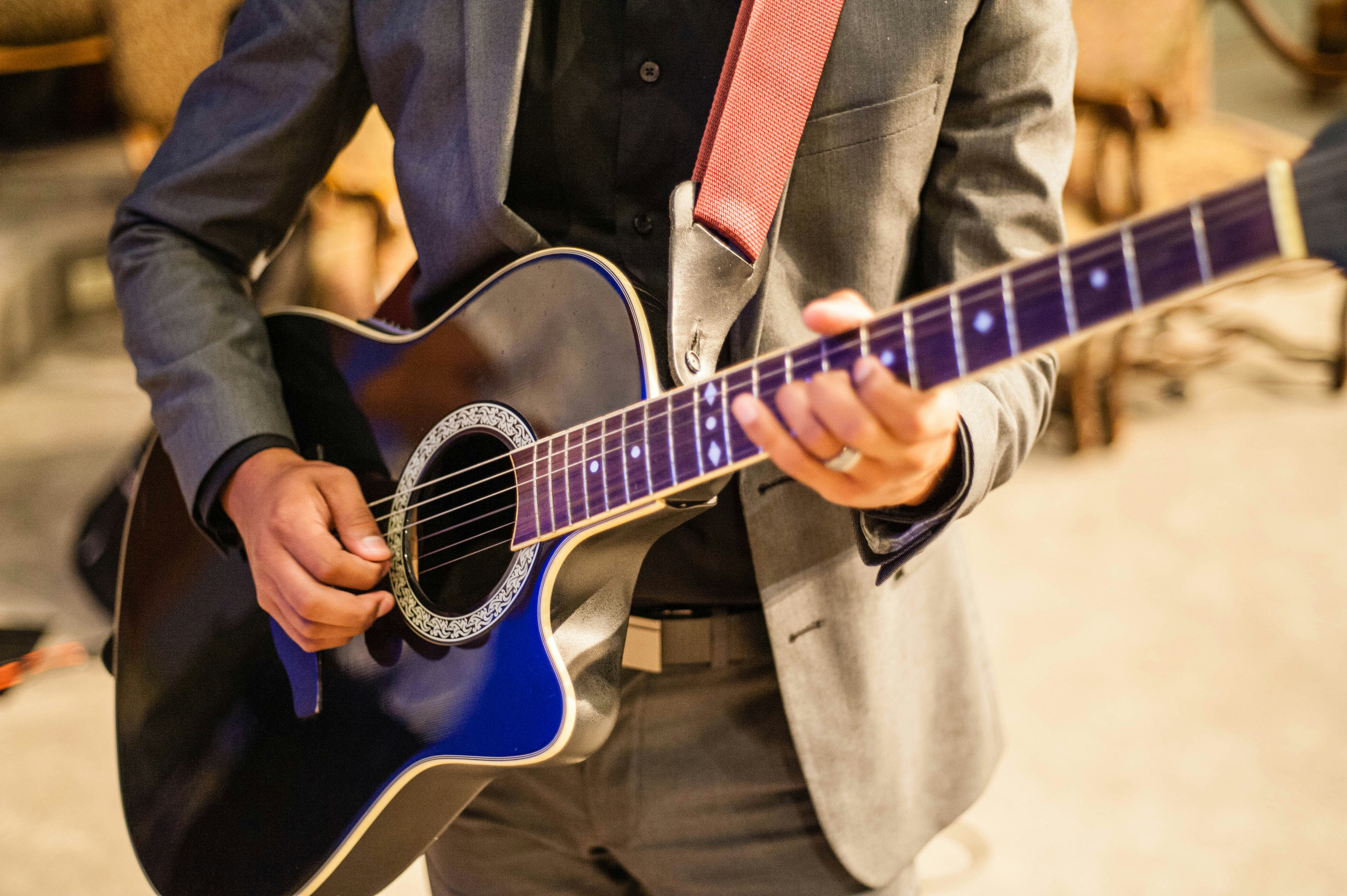 Live acoustic guitarist performing wedding ceremony music for intimate weddings in King and Snohomish counties